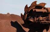 S&P warns BHP rating vulnerable to weak iron ore, oil prices
